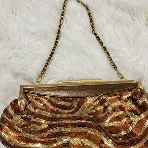 Woman  slightly used gold and bronze purse